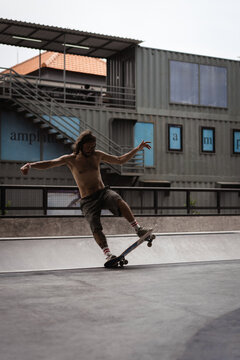 Young men skateboarding in skate park, Canggu, Bali, Indonesia