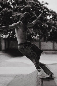 Young men skateboarding in skate park, Canggu, Bali, Indonesia