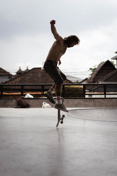 Young men skateboarding in skate park, Canggu, Bali, Indonesia