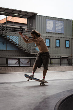 Young men skateboarding in skate park, Canggu, Bali, Indonesia