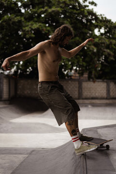 Young men skateboarding in skate park, Canggu, Bali, Indonesia
