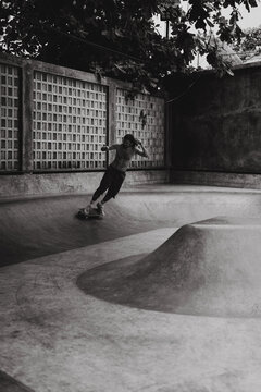 Young men skateboarding in skate park, Canggu, Bali, Indonesia