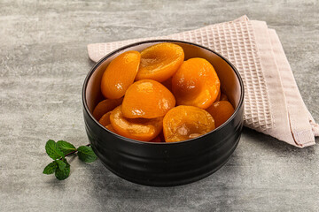 Sweet canned apricots with syrope