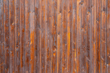 Vertical narrow brown boards as texture.