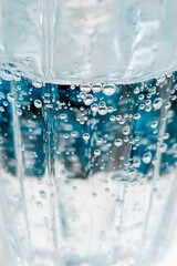 Bubbles in the water. Vertical photo.