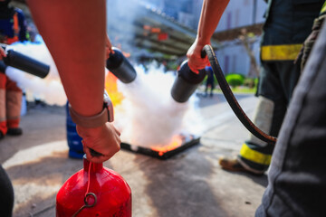 Company employees are undergoing basic fire extinguishing training, fire extinguisher use, safety...