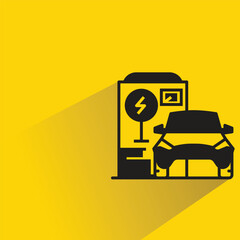electric car charging station icon with shadow on yellow background