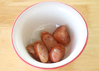 sausage in a bowl on the table