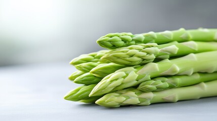 Fresh asparagus bunch.  Close-up view of a stack of fresh green asparagus spears.  Healthy, vibrant, and ready to eat