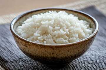 A Ceramic Bowl Contains Fluffy White Cooked Rice for Eating