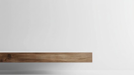 A minimalist wooden buffet with a matte white backdrop, designed to highlight a clean and modern aesthetic with copy space.