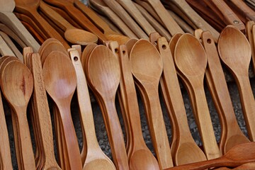 wooden spoons on wooden background