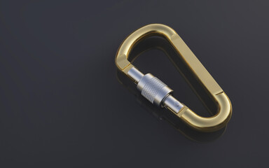 Golden carabiner on a dark background. 
