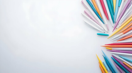 Colorful pencils arranged on white background, copy space, art supplies, craft project