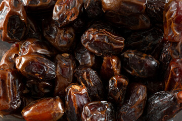 A top down view of a pile of medjool dates, as a background.
