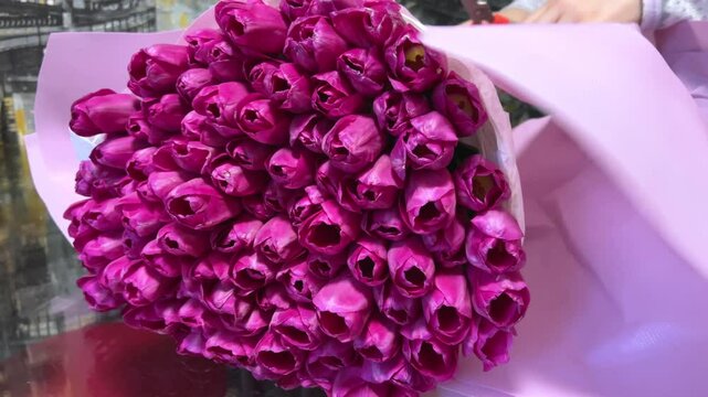 unpacking a huge bouquet of tulips