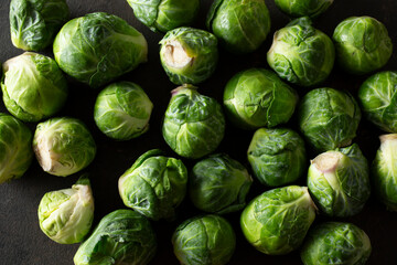 A top down view of a layer of Brussels sprouts, as a background.