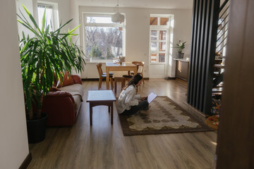 Woman working using laptop from home 