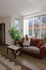 Woman working using laptop from home 