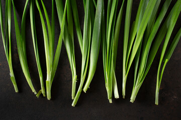 A top down view of some sprigs of nira, as a background.