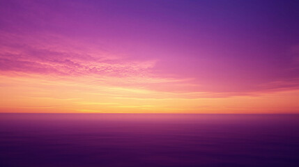 Fototapeta premium Vibrant sunset sky with fiery orange horizon blending into a serene purple twilight, capturing a peaceful and colorful atmospheric scene.