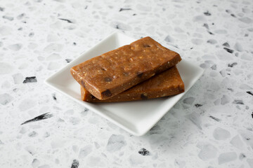 A view of a stack of protein bars on a plate.