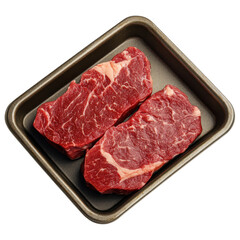 Fresh beef steaks displayed on metal tray, showcasing rich red color and marbling, perfect for grilling or cooking