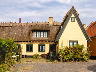 Historic yellow house with thatched roof in Dragør Old Town, Amager Island, Capital Region, Denmark