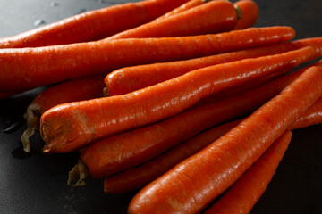 A view of a pile of orange carrots.