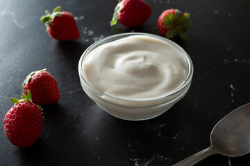 A view of a small glass bowl of cashew yogurt.