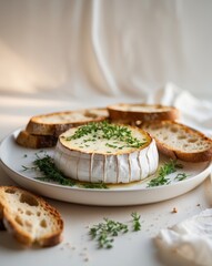 Delicious baked brie with herbs served with toasted bread slices.