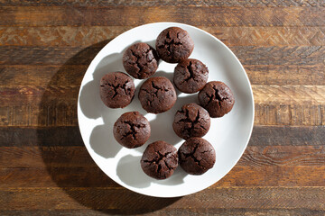 A top down view of a muffin pan of flax seed chocolate brownies.