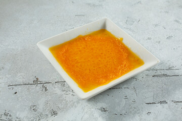 A view of a small plate of melted cheese.