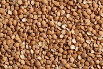 Fototapeta premium An overhead view displays a lot of brown buckwheat kernels