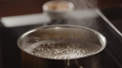 pasta boiling in saucepan on induction stove