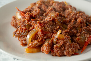 A closeup view of a plate of corned beef.