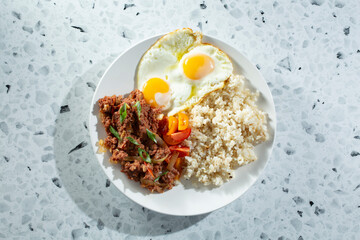 A top down view of a corned beef breakfast plate.
