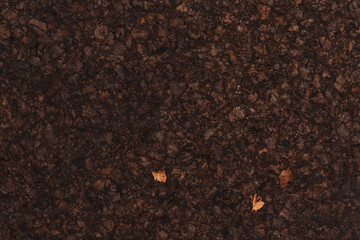 Texture of dark cork with oil finish
