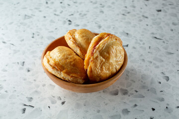 A view of a bowl of meat pies.