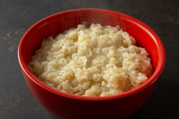 A view of a bowl of alphabet pasta.