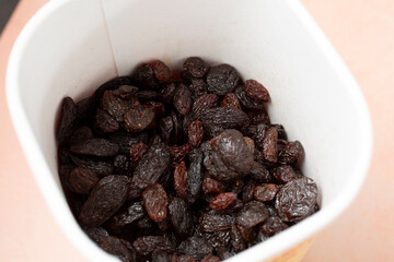 A view of a container of raisins.