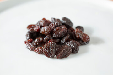 A view of a pile of raisins on a plate.