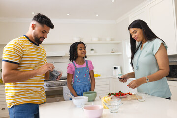 In kitchen, family preparing breakfast together, sharing quality time and fresh fruit © wavebreak3