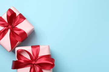 Beautiful gift boxes on color background