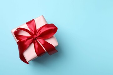 Beautiful gift box on color background