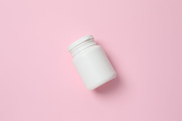 White bottl on color  background, top view