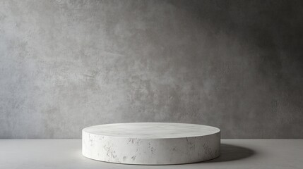 Empty round marble podium on a textured wall.  Ideal for product presentation
