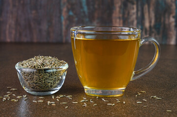 Jeera water also called as cumin water is served in a cup.