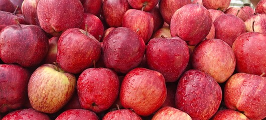 A pile of fresh red apples open sell in Indian market.
