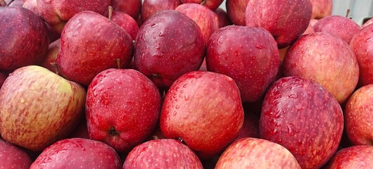 A pile of fresh red apples open sell in Indian market.